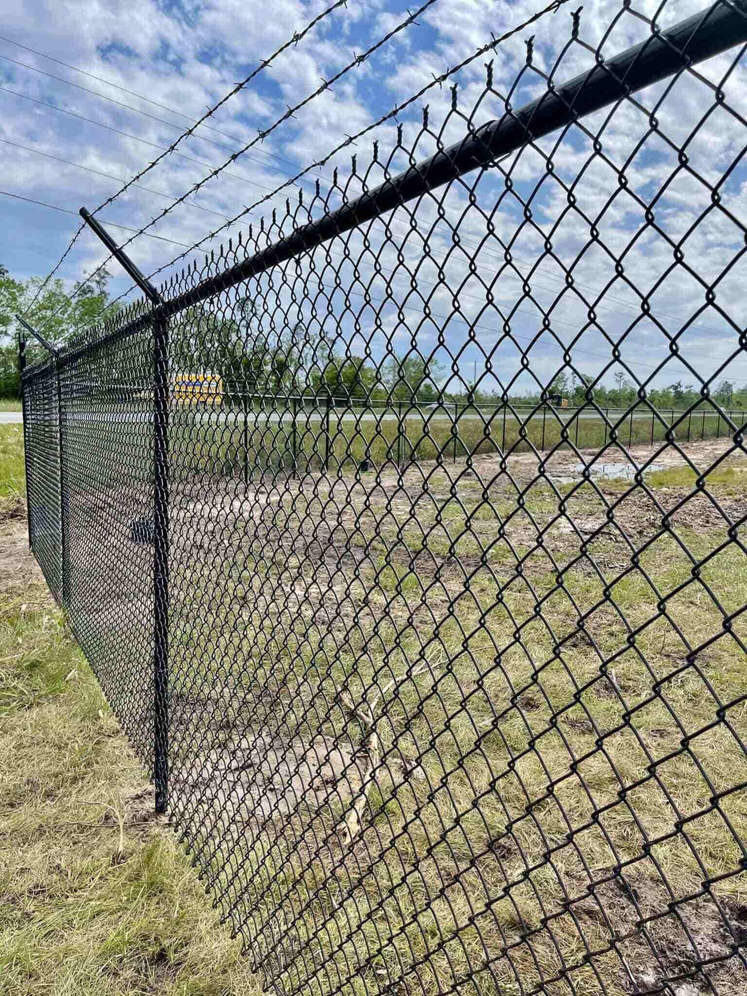 Photo of Black Galvanized Chain Link Fence with Barbed Wire on Top