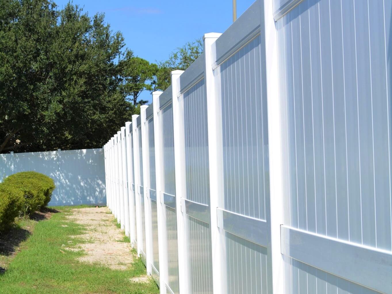 Photo of a white vinyl privacy fence