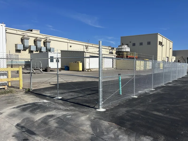 Galvanized chain link fence around an industrial yard in Panama City installed by Mr. Fence
