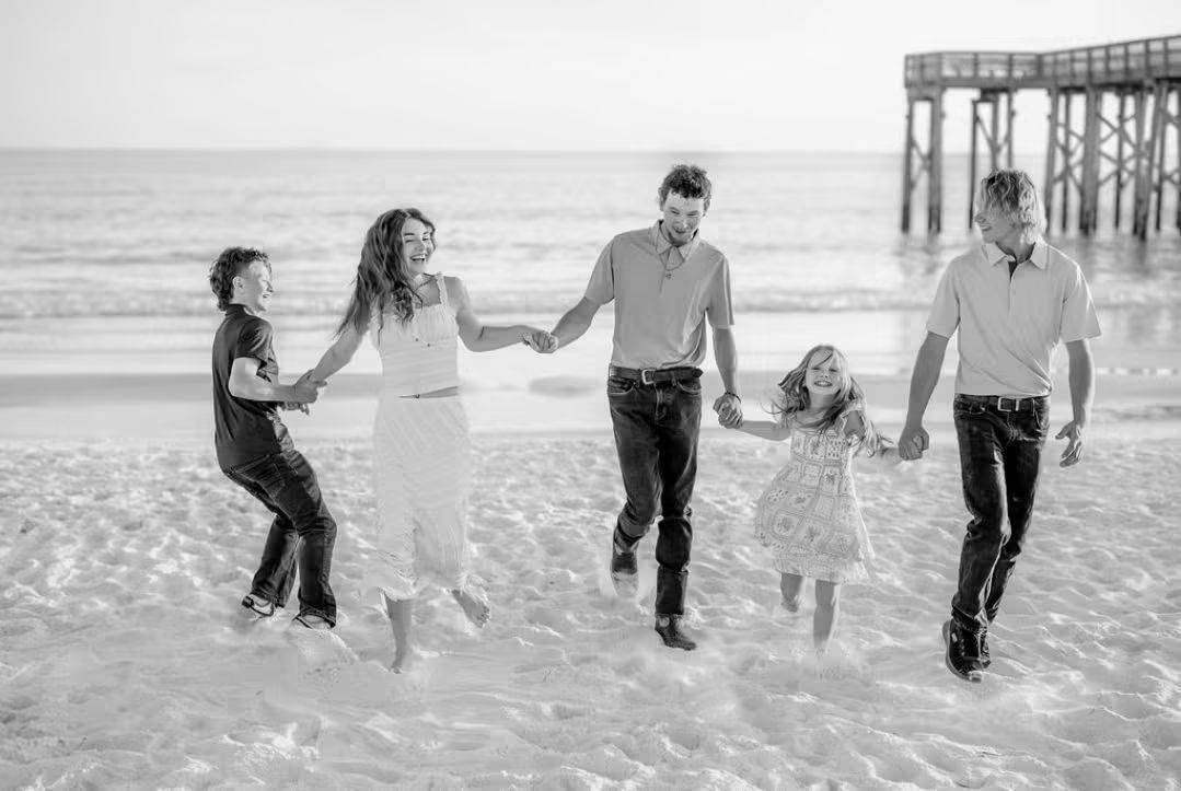 Joshua Glover's kids running hand in hand on Panama City Beach