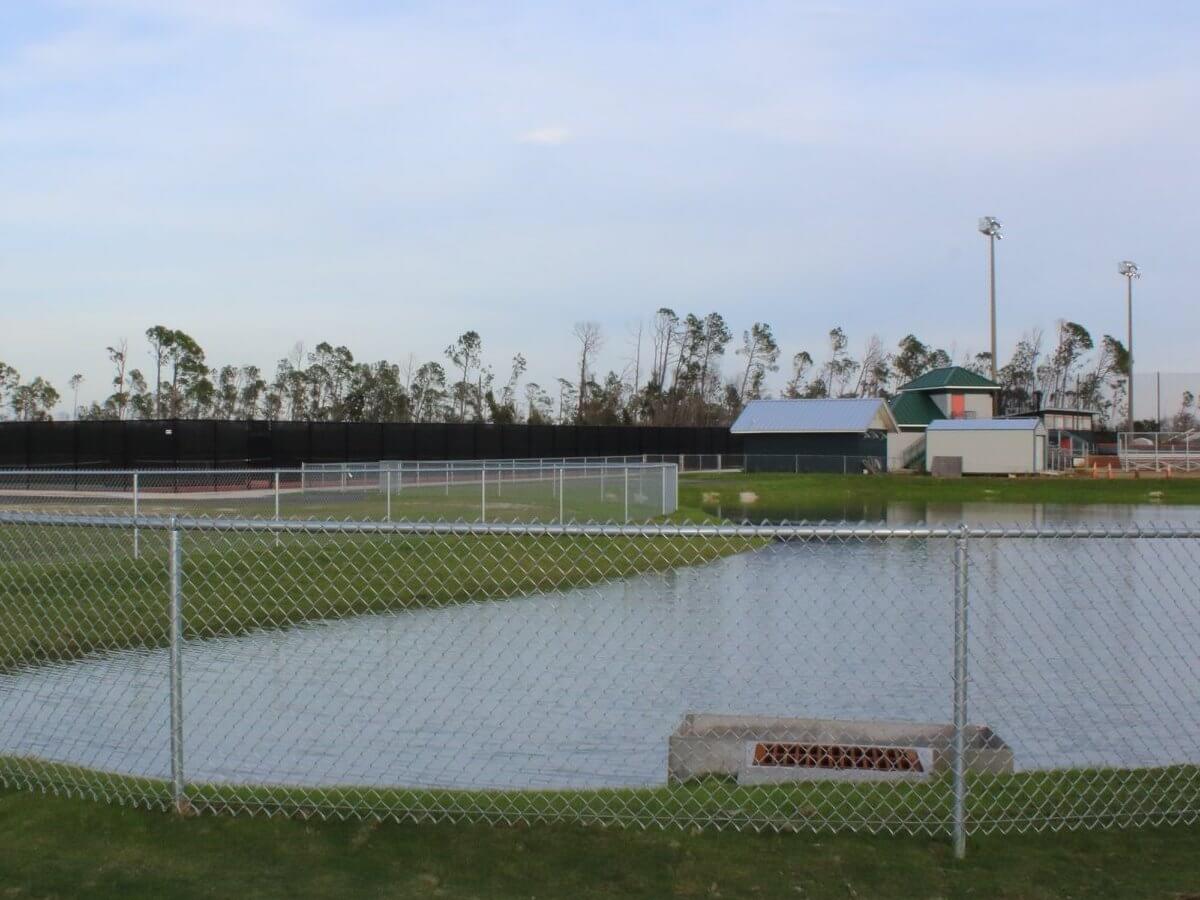 Commercial fence around a retention pond