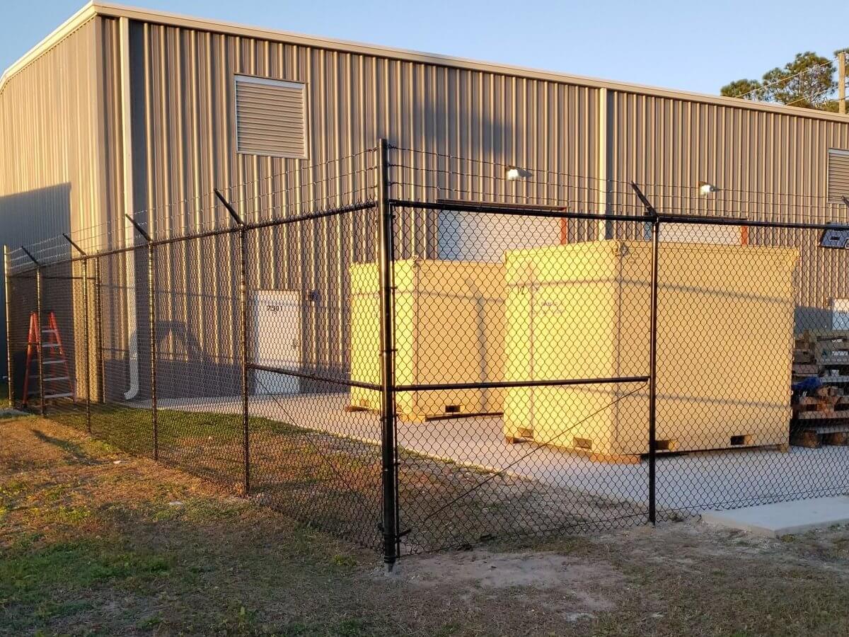 Commercial chain link enclosure at a warehouse