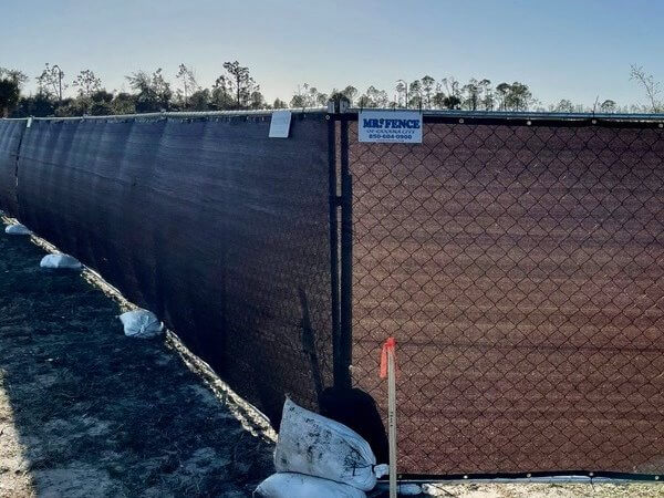 Chain link fence with black privacy windscreen