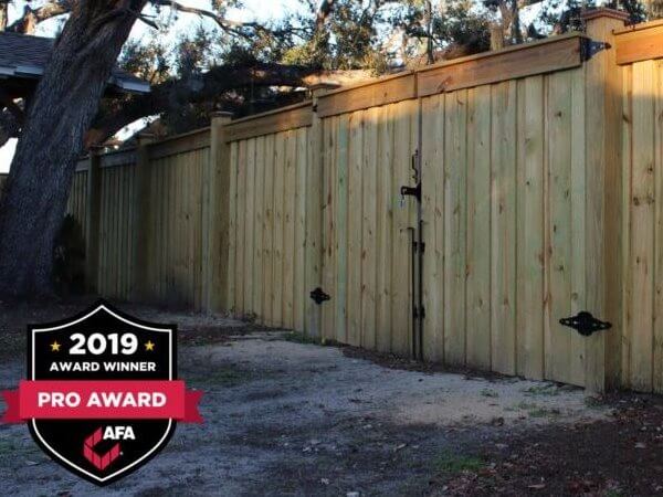 Wood privacy fence with a matching gate