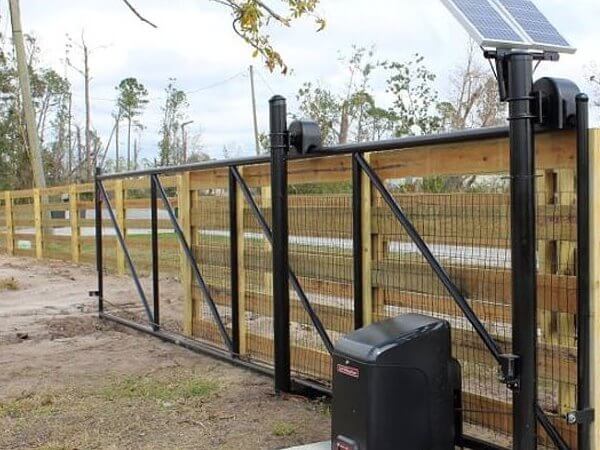 Automatic gate operator on a wood driveway gate
