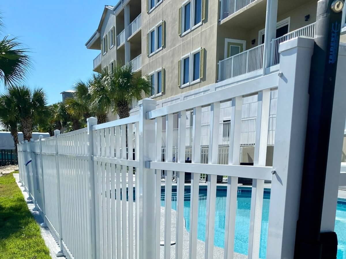 White pool fence at an apartment building