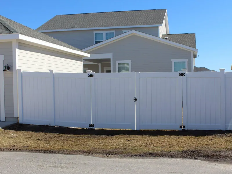 White vinyl privacy fence with double gate